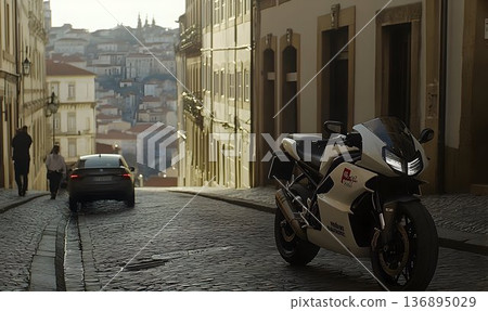 Sportbike parked on cobblestone street with distant cityscape vi 136895029