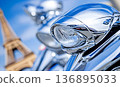 Chrome Motorcycle Headlight Reflecting Sky with Eiffel Tower in 136895033