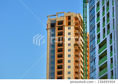 Construction new building.Large high rise cranes Construction new building.Large high rise cranes 136895404
