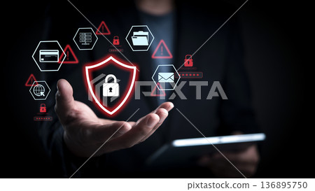 Cybersecurity threat alert concept. Man hand show red shield padlock icon. Data protection network security. Hacker attack warning. Virtual interface internet finance password credit card protection. 136895750