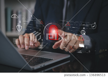 Businessman hand using laptop with virtual padlock icon for cybersecurity data protection. Network security system technology for business internet privacy and protect information access concept. 136896513