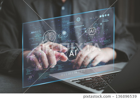 Man coding AI laptop with futuristic virtual dashboard. Analyzing data, developing software with machine learning and neural network icons. Digital transformation and deep learning technology concept. Man coding AI laptop with futuristic virtual dashboard. Analyzing data, developing software with machine learning and neural network icons. Digital transformation and deep learning technology concept. 136896539