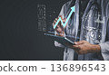 Doctor using tablet analyze patient data on virtual screen. Medical technology shows health data analytics, growth chart success. Healthcare innovation for future diagnosis and treatment concept. 136896543