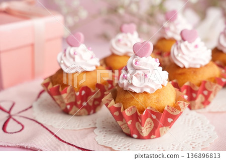 Cute handmade cupcakes with heart-shaped chocolate and cake Cute handmade cupcakes with heart-shaped chocolate and cake 136896813