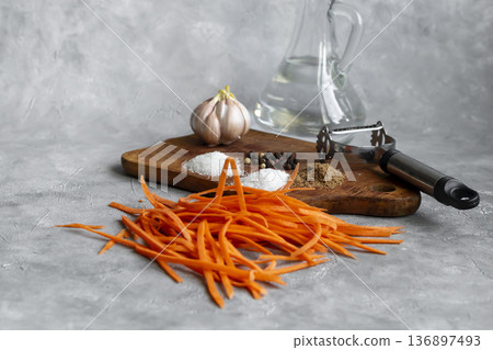 Ingredients for carrot and green onion salad. Vegetable cutting process. 136897493