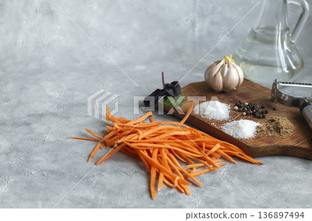 Ingredients for carrot and green onion salad. Vegetable cutting process. Ingredients for carrot and green onion salad. Vegetable cutting process. 136897494