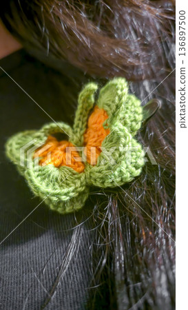 Butterflies made of colored yarn, crocheted on a dark surface. Handmade. Butterflies made of colored yarn, crocheted on a dark surface. Handmade. 136897500