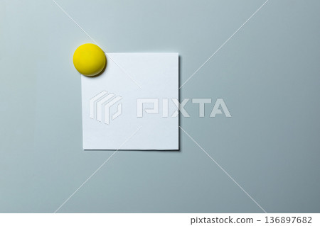 A white note magnetized to the refrigerator door A white note magnetized to the refrigerator door 136897682