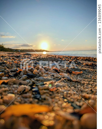 Okinawa sunset: Golden hour light reflecting off the sandy beach Okinawa sunset: Golden hour light reflecting off the sandy beach 136899045