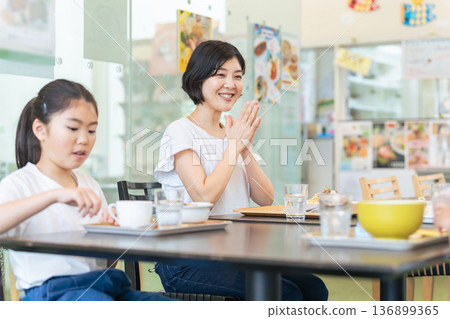 Family eating at a restaurant 136899365