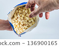 Ready popcorn in an opened package 136900165