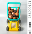 Natural vegetables from the hypermarket in a baby grocery cart 136900171