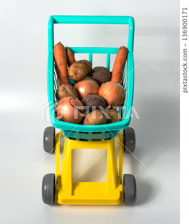 Natural vegetables from the hypermarket in a baby grocery cart Natural vegetables from the hypermarket in a baby grocery cart 136900171