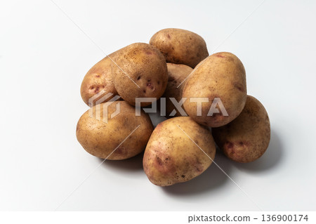 Raw potatoes isolated on a white background. A popular vegetable. An essential product for cooking 136900174