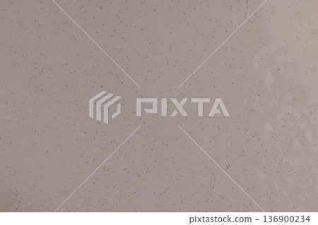 white ceramic bowl with black and other small dots on the surface in water droplets, close up white ceramic bowl with black and other small dots on the surface in water droplets, close up 136900234