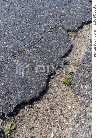 the paved edge of the road with asphalt , the edge of the paved road for cars 136900236