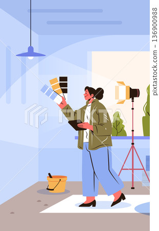 Interior designer choosing color palette modern workspace woman holding swatches and tablet in studio with lighting equipment plants bucket Interior designer choosing color palette modern workspace woman holding swatches and tablet in studio with lighting equipment plants bucket 136900988