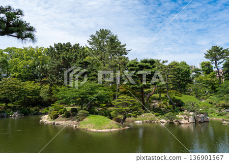 Traditional Shukkei-en Japanese garden with pond in Hiroshima, Japan 136901567