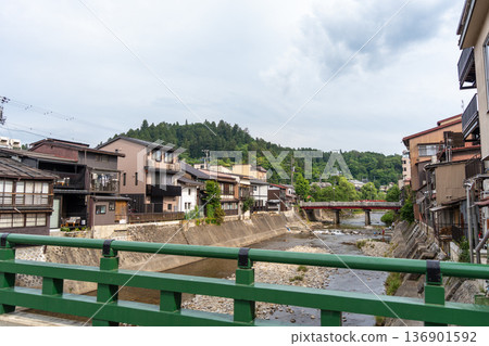 Miyagawa River flowing through traditional houses in Takayama, Japan Miyagawa River flowing through traditional houses in Takayama, Japan 136901592