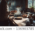 Photo of a woman cooking eggs in the kitchen in the morning 136903785