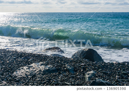Beautiful seascape with waves breaking on the rocky shore. Beautiful seascape with waves breaking on the rocky shore. 136905398