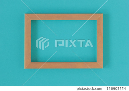 Teal Color Background. Wood frame mockup on teal background with empty space for poster, presentation layout. Concept of teal color 2026 trend for design marketing, wall template Teal Color Background. Wood frame mockup on teal background with empty space for poster, presentation layout. Concept of teal color 2026 trend for design marketing, wall template 136905554