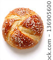 Golden Brown Kaiser Roll Bread Bun Isolated on White Background - Overhead Top View of Single Fresh Crusty Roll for Sandwiches and Breakfast 136905600