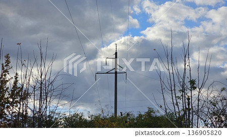 A high-voltage transmission tower is a structure that supports overhead power lines A high-voltage transmission tower is a structure that supports overhead power lines 136905820