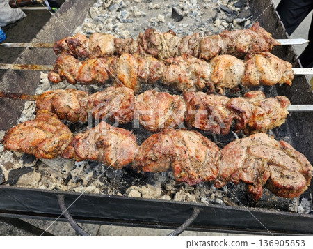Shish kebab. ork meat threaded onto skewers and grilled. Shish kebab. ork meat threaded onto skewers and grilled. 136905853