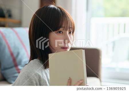 A woman reading A woman reading 136905925