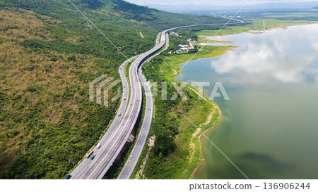Drone shot The M6 motorway Nakhon Ratchasima Province - Bang Pa-in Lam Ta Khong River and Mountain. Motorway Korat Thailand 136906244