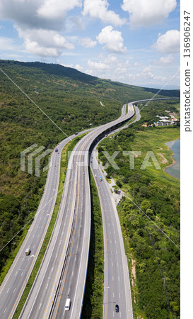 Drone shot The M6 motorway Nakhon Ratchasima Province - Bang Pa-in Lam Ta Khong River and Mountain. Motorway Korat Thailand 136906247