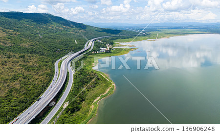 Drone shot The M6 motorway Nakhon Ratchasima Province - Bang Pa-in Lam Ta Khong River and Mountain. Motorway Korat Thailand 136906248