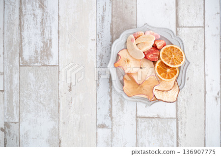 Dried fruits on a plate viewed from above Dried fruits on a plate viewed from above 136907775