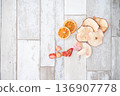 Dried fruits on a white table 136907778