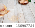 Pouring tea into a cup 136907784