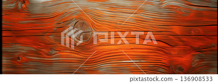 Textured wooden plank, showcasing the wood's grain and knots in vibrant orange tones. 136908533