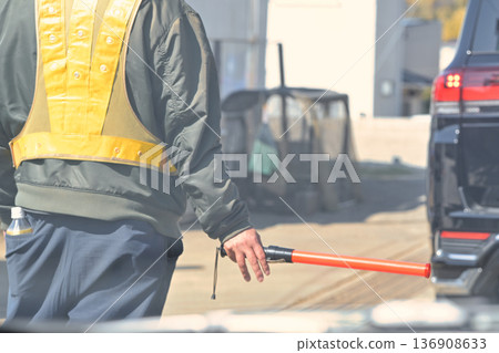 Security guard to guide traffic Security guard to guide traffic 136908633