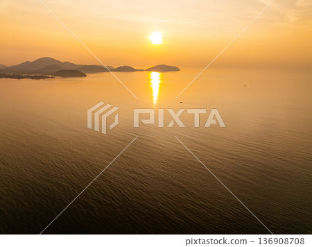 Aerial view sunset sky, Nature beautiful Light Sunset or sunrise over sea, Colorful Sky with Amazing clouds and waves in sunset sky background Aerial view sunset sky, Nature beautiful Light Sunset or sunrise over sea, Colorful Sky with Amazing clouds and waves in sunset sky background 136908708