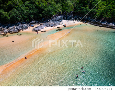 Aerial view of a blue sea surface water texture background and sun reflections Aerial flying drone view Waves water surface texture on sunny tropical ocean Aerial view of a blue sea surface water texture background and sun reflections Aerial flying drone view Waves water surface texture on sunny tropical ocean 136908744