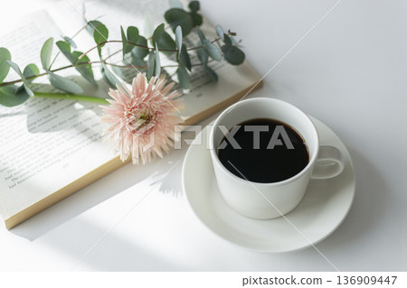 Morning reading and coffee, pink flowers and soft light on the table Morning reading and coffee, pink flowers and soft light on the table 136909447