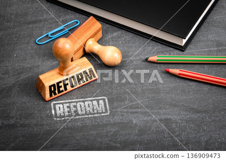 REFORM Policy Change Concept Shown With Wooden Stamp On Chalkboard 136909473