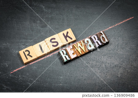 RISK Versus REWARD Business Decision Concept With Wooden Letter Blocks RISK Versus REWARD Business Decision Concept With Wooden Letter Blocks 136909486