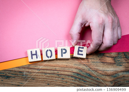 HOPE Positive Outlook And Resilience Concept Shown With Wooden Letter Blocks 136909499