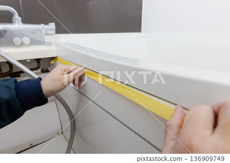 Masking when replacing caulking in the bathroom Masking when replacing caulking in the bathroom 136909749