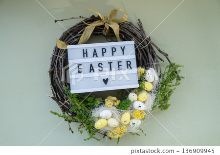 HAPPY EASTER text Handmade Easter wreath festive yellow egg decorations. Traditional holiday preparation craft creative decor. Sustainable responsible holiday gift workshop creation. Copy space Simple HAPPY EASTER text Handmade Easter wreath festive yellow egg decorations. Traditional holiday preparation craft creative decor. Sustainable responsible holiday gift workshop creation. Copy space Simple 136909945