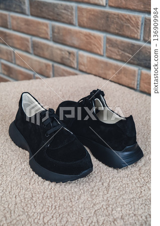 Elegant black leather womens shoes blank product for branding displayed. New casual female sneakers no-brand footwear e-commerce. No logo product Elegant black leather womens shoes blank product for branding displayed. New casual female sneakers no-brand footwear e-commerce. No logo product 136909984