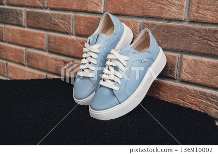 Elegant blue leather womens shoes blank product for branding displayed. New casual female sneakers no-brand footwear e-commerce. No logo product unbranded fashion Elegant blue leather womens shoes blank product for branding displayed. New casual female sneakers no-brand footwear e-commerce. No logo product unbranded fashion 136910002