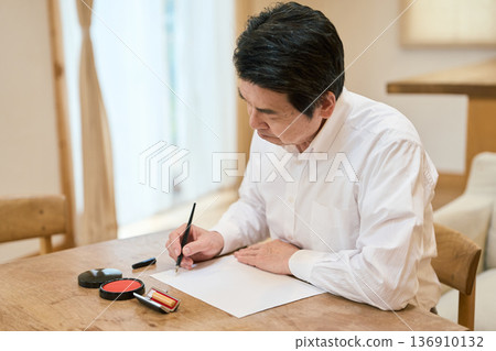Senior Asian man thinking about the contents of his will 136910132