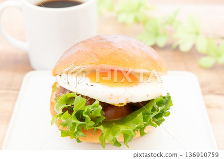 Delicious sunny side up teriyaki burger and hot coffee 136910759